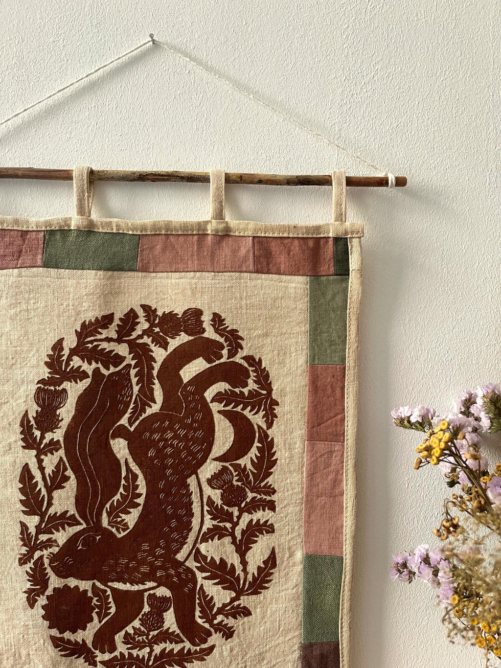 Hand-printed fabric tapestry with quilted frame “Hare and thistle”