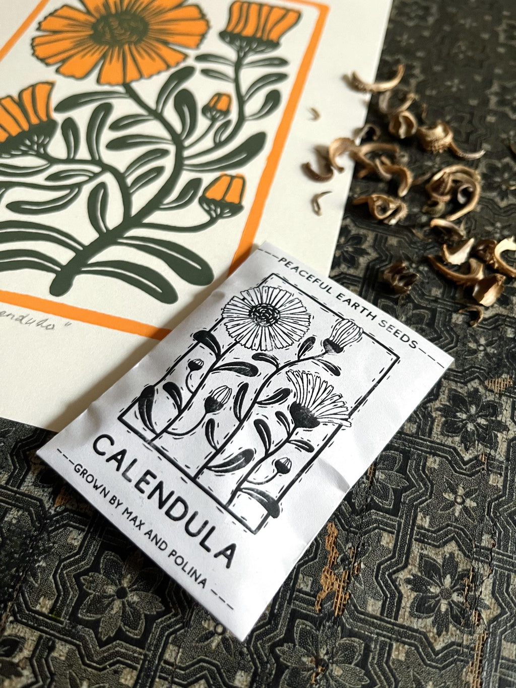 Limited edition hand-carved two-colour linocut print “Calendula Flower“ + Seeds