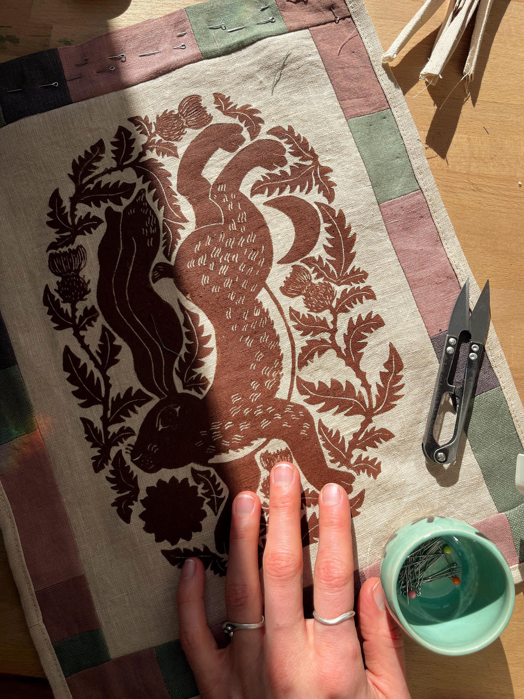 Hand-printed fabric tapestry with quilted frame “Hare and thistle”