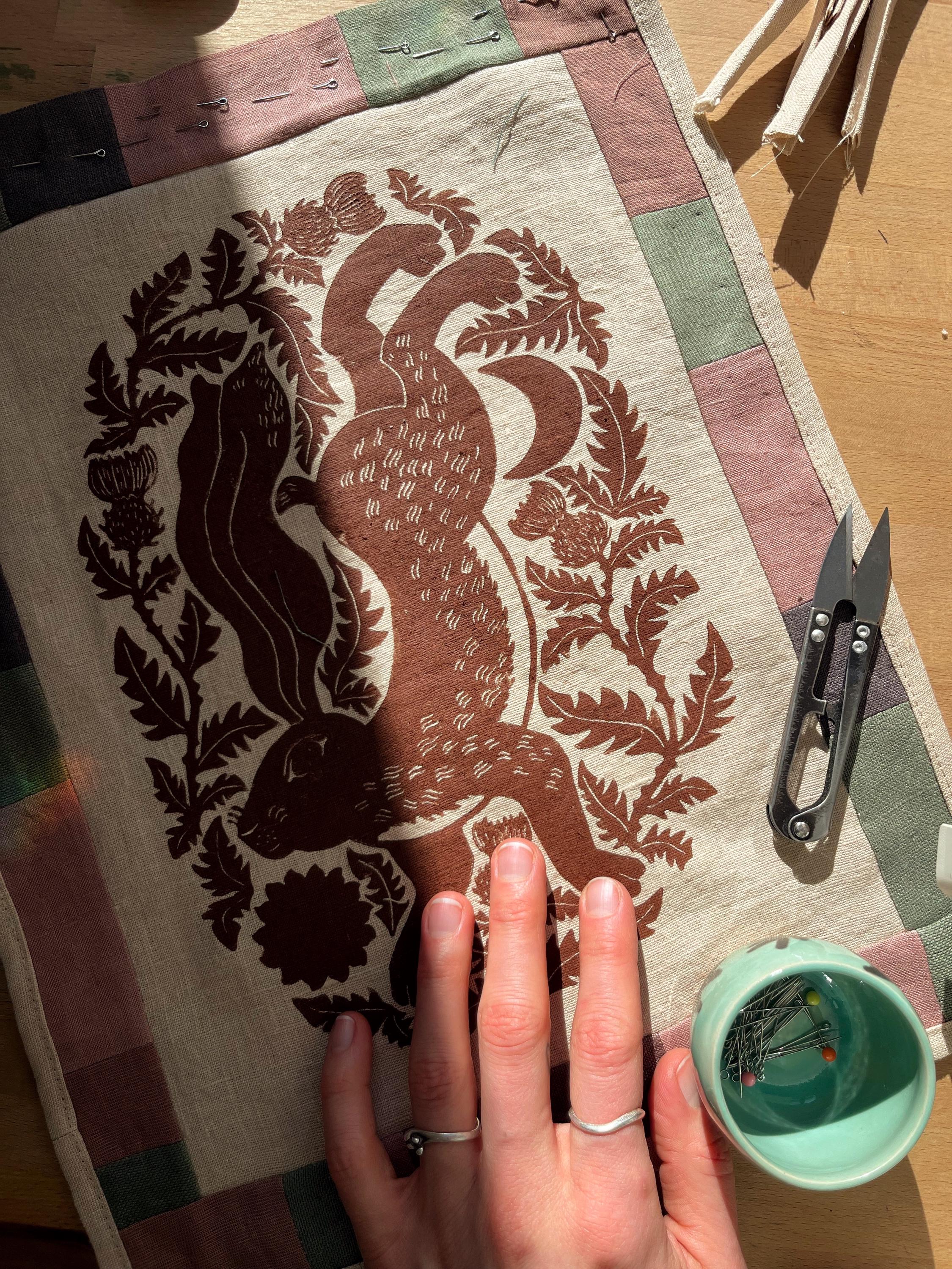 Hand-printed fabric tapestry with quilted frame “Hare and thistle”
