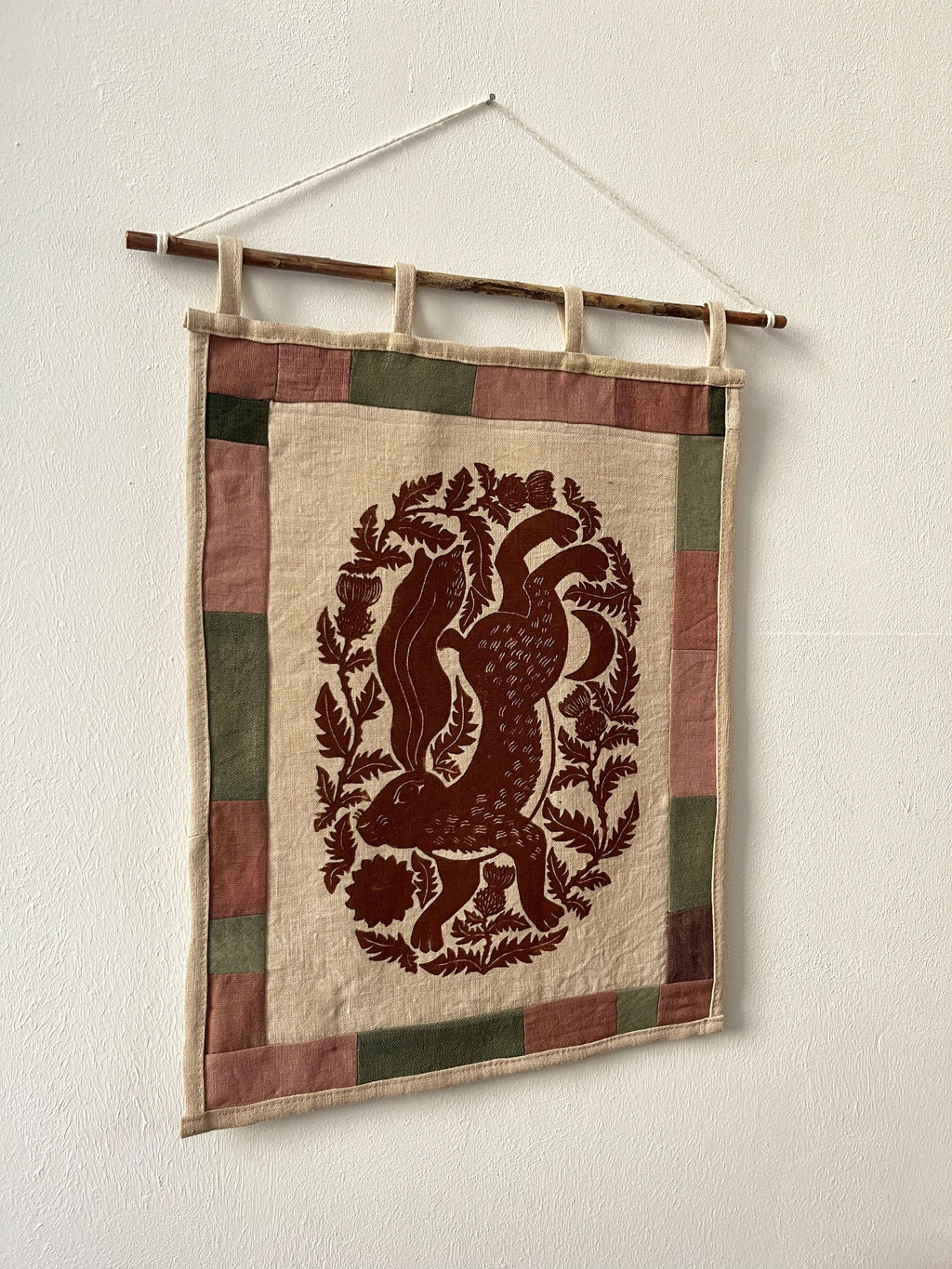 Hand-printed fabric tapestry with quilted frame “Hare and thistle”