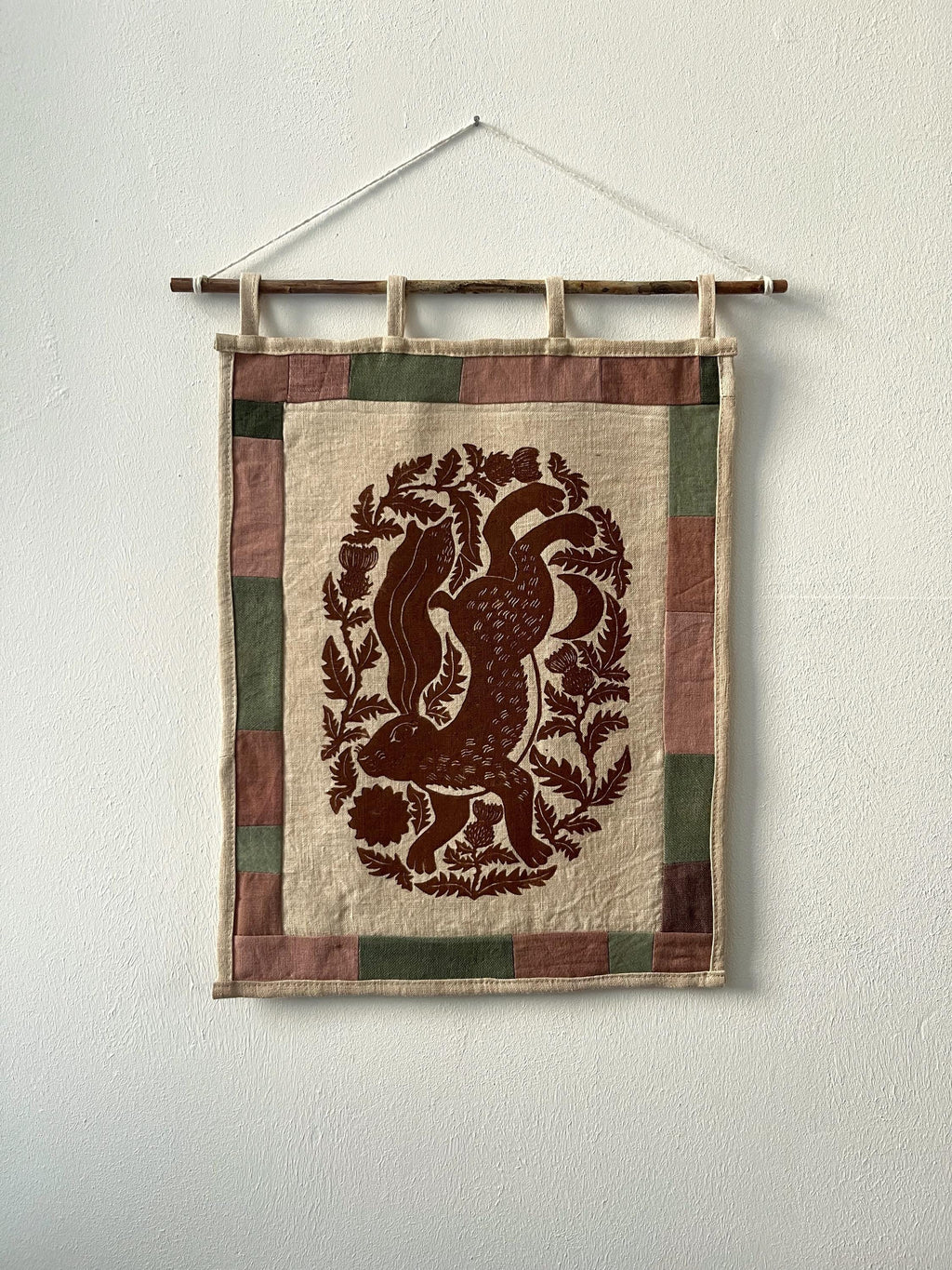 Hand-printed fabric tapestry with quilted frame “Hare and thistle”